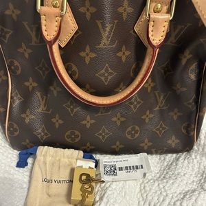 Authentic Louis Vuitton Speedy Bandouliere 25 -Like New with tags.